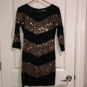Black and gold sequin dress